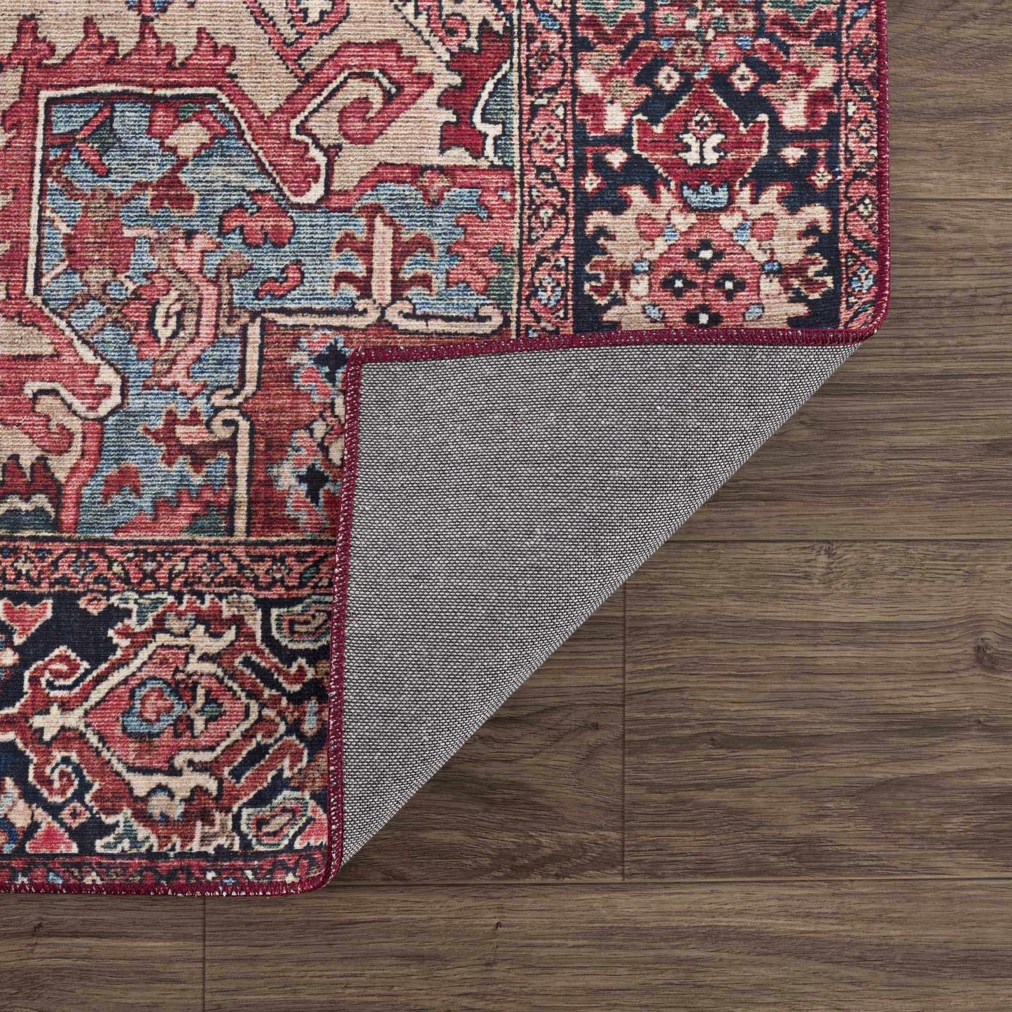 Neyland Area Rug by Boutique Rugs, red blue oriental pattern with beige accents on wood on Tampa Home & Garden Store