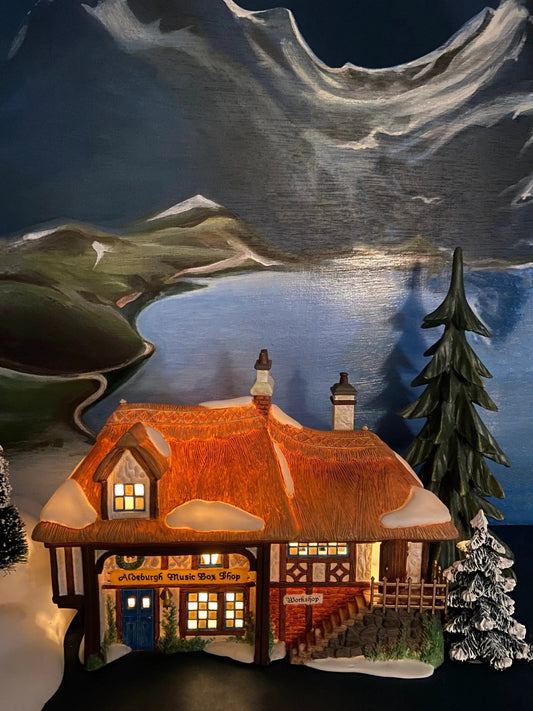 Illuminated Dickens Village music box cottage with warm windows Aldeburgh Music Box Shop on Tampa Home & Garden Store