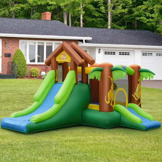 Kids Inflatable Jungle Bounce House Castle with green and blue slides in backyard on Tampa Home & Garden Store