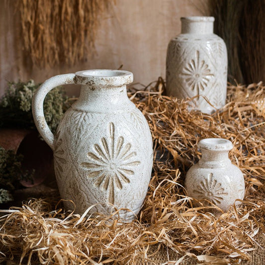 Three white ceramic vases with a carved floral motif in rustic glaze, RusticReach on Tampa Home & Garden Store