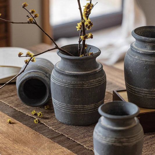 Handmade gray clay pottery vases set of 4 by RusticReach with banded texture on wood table on Tampa Home & Garden Store