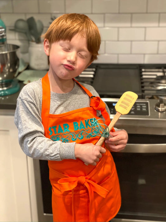 Kids Star Baker Embroidered Apron orange with teal embroidery for kids on Tampa Home & Garden Store
