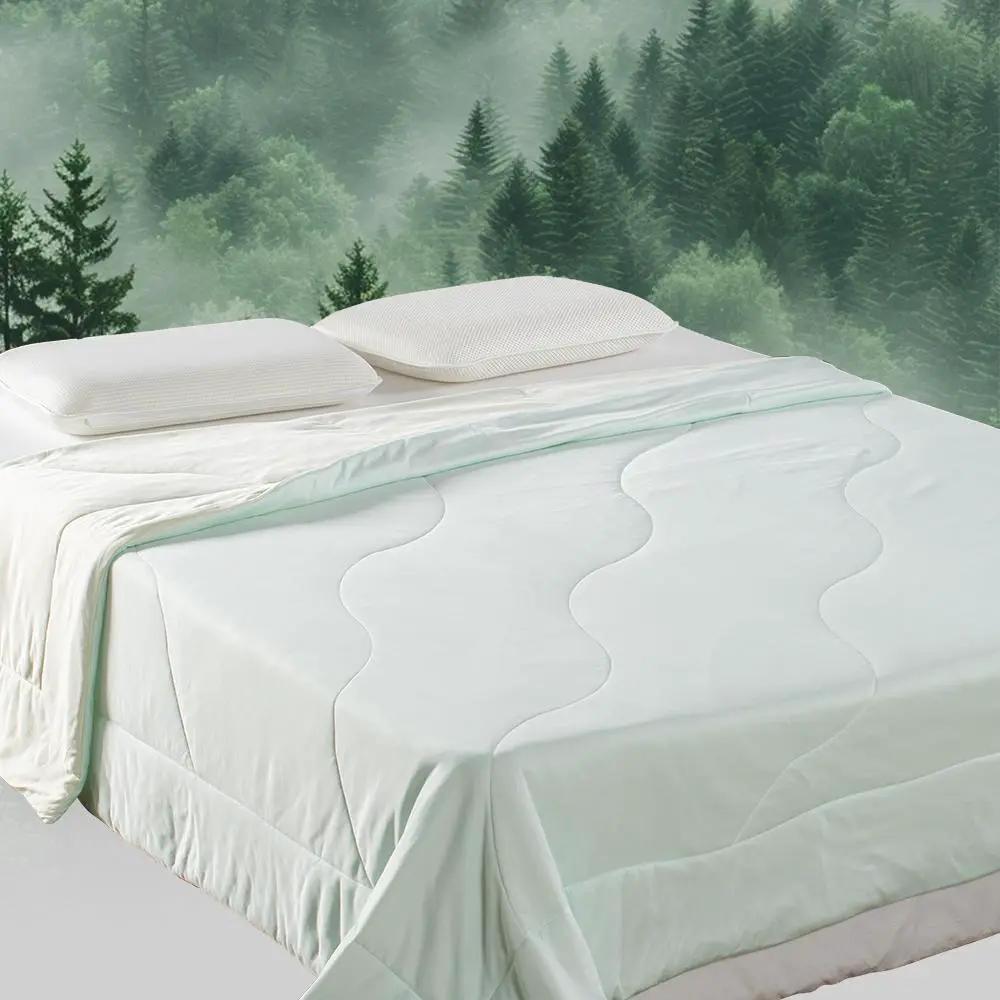 Kasentex All Season Cooling Blanket Comforter in pale mint with wave quilt pattern on bed on Tampa Home & Garden Store
