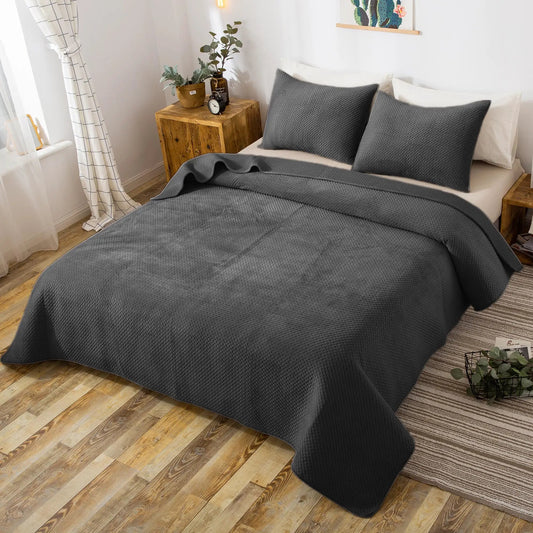 Kasentex Plush Poly Velvet Quilt Set dark gray textured weave with two shams on bed on Tampa Home & Garden Store