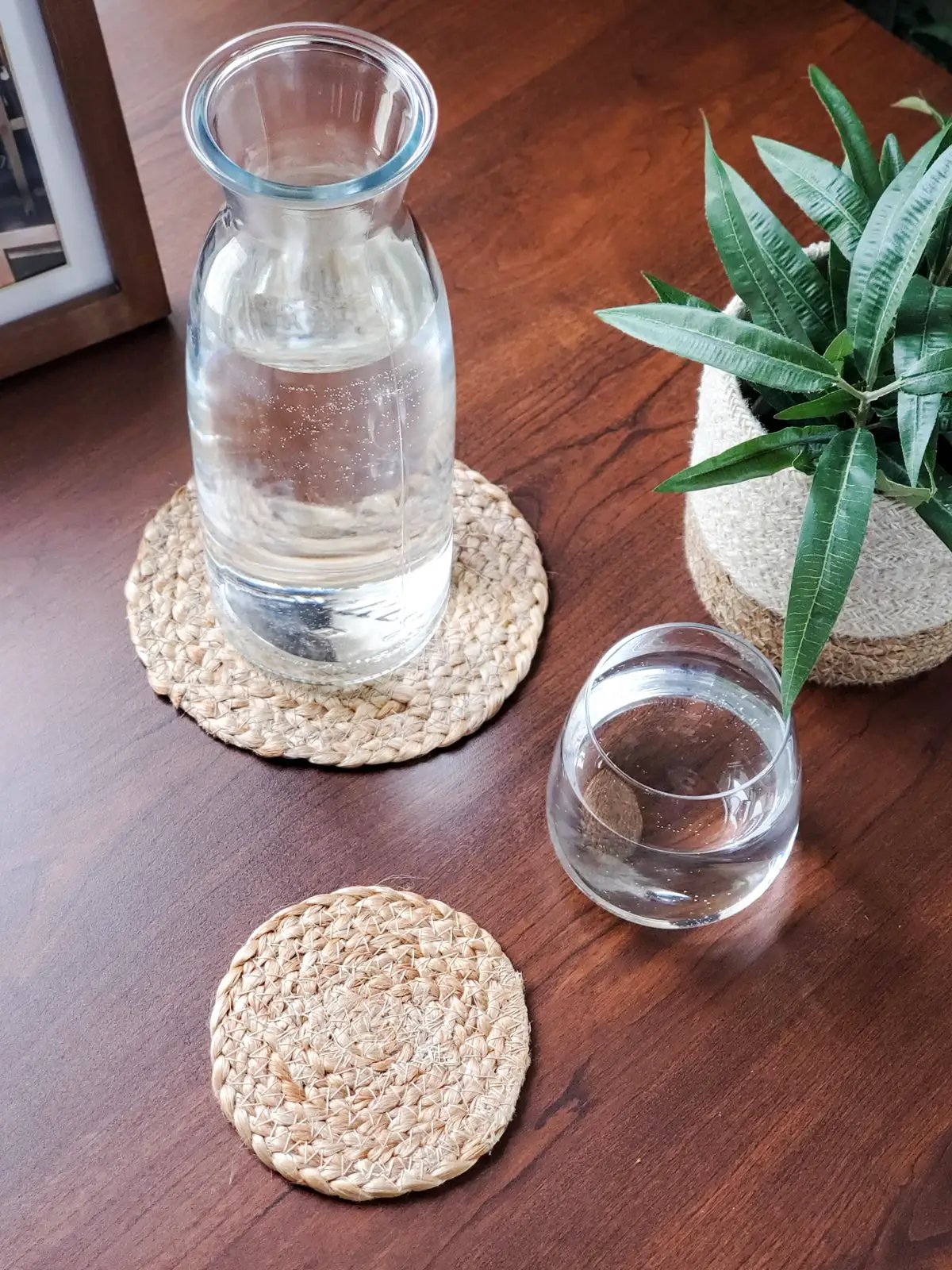 Kata Natural Drink Coasters set of 4, natural woven round coasters on wood table on Tampa Home & Garden Store