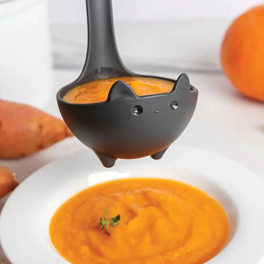 Katie Ladle Black Cat Soup Ladle by OTOTO DESIGN scooping soup on Tampa Home & Garden Store on Tampa Home & Garden Store