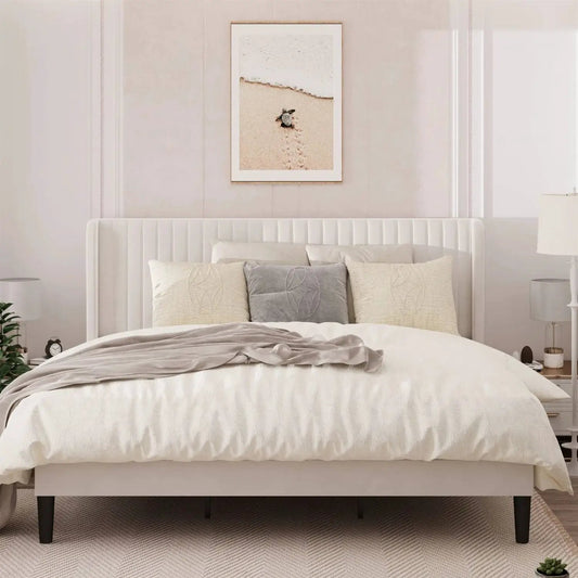King white velvet bed with wingback headboard in a white platform frame with bedding on Tampa Home & Garden Store