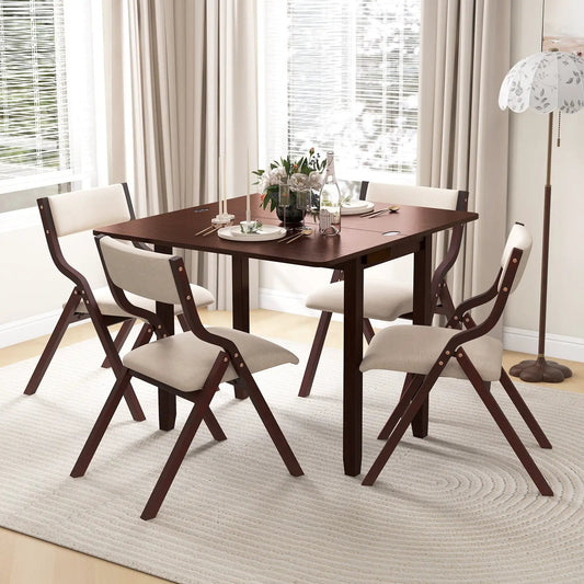 Expandable kitchen table set for two with dark wood and 4 beige upholstered folding chairs on Tampa Home & Garden Store
