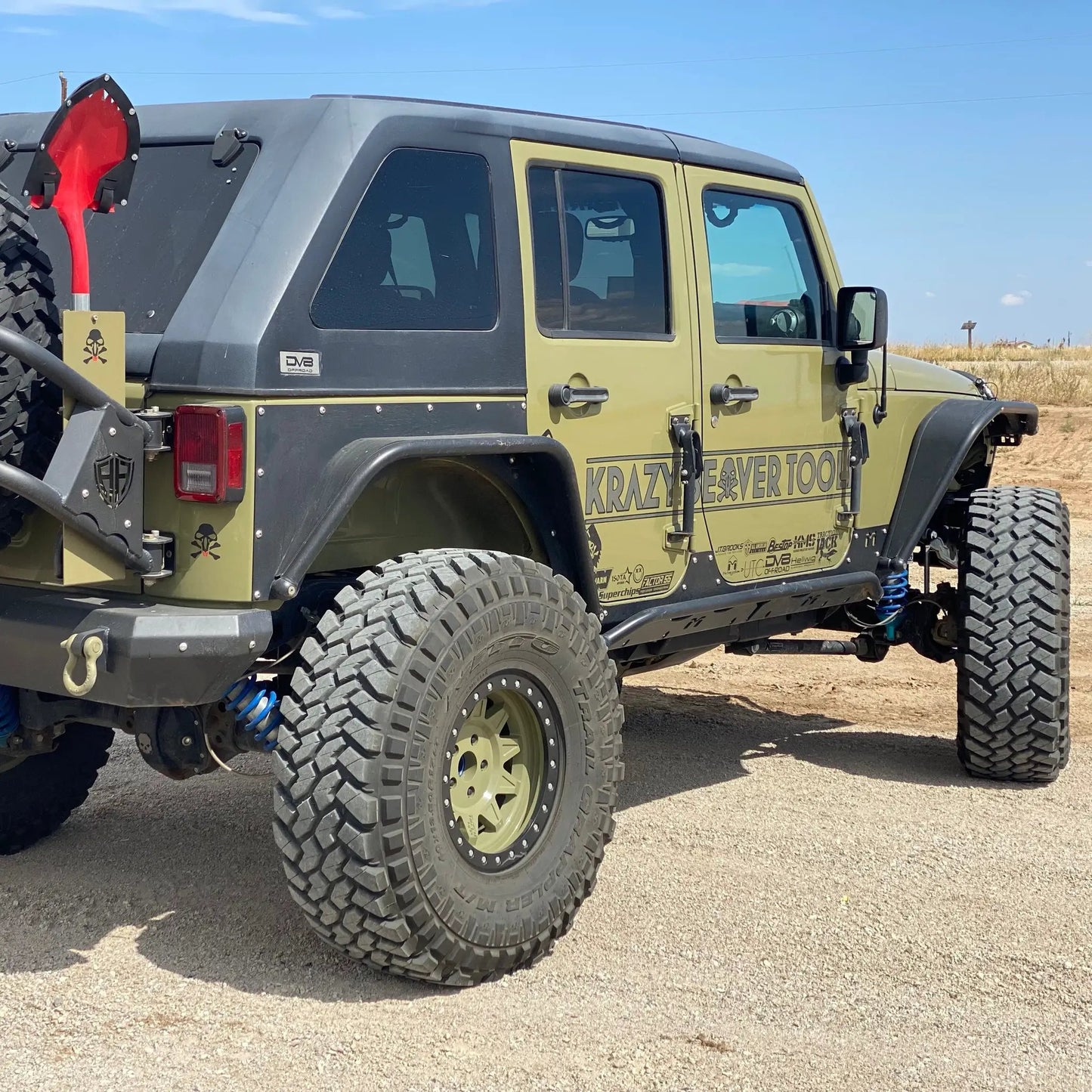 Krazy Beaver Shovel textured red head and handle rear-mounted on rugged off-road Jeep on Tampa Home & Garden Store