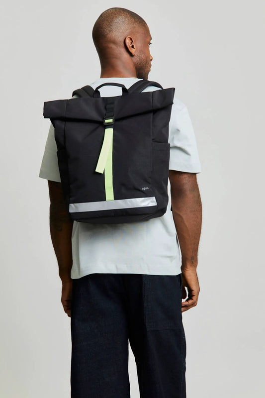 Lefrik Lars Roll laptop backpack black lime Vandra with neon lime strap on model on Tampa Home & Garden Store