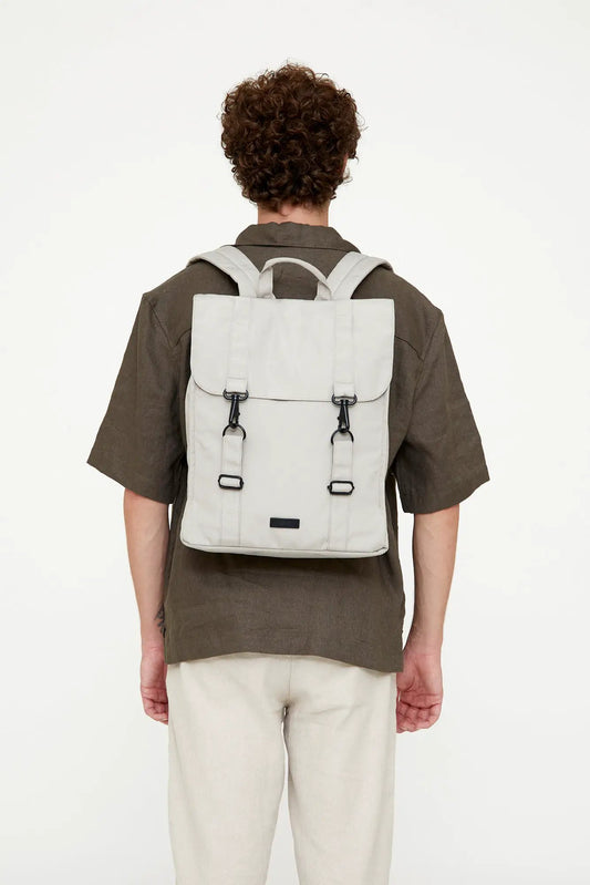 Handy XL Backpack Fossil, light gray backpack with two vertical buckle straps, back view on Tampa Home & Garden Store