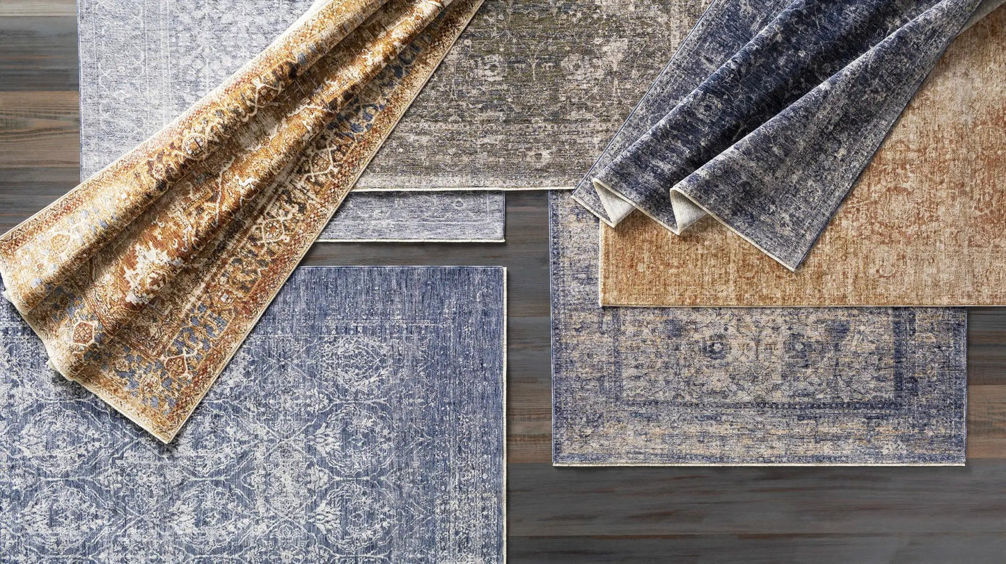 Accokeek Luxe Area Rug in Navy and Beige Boutique Rugs rug display on wood floor on Tampa Home & Garden Store