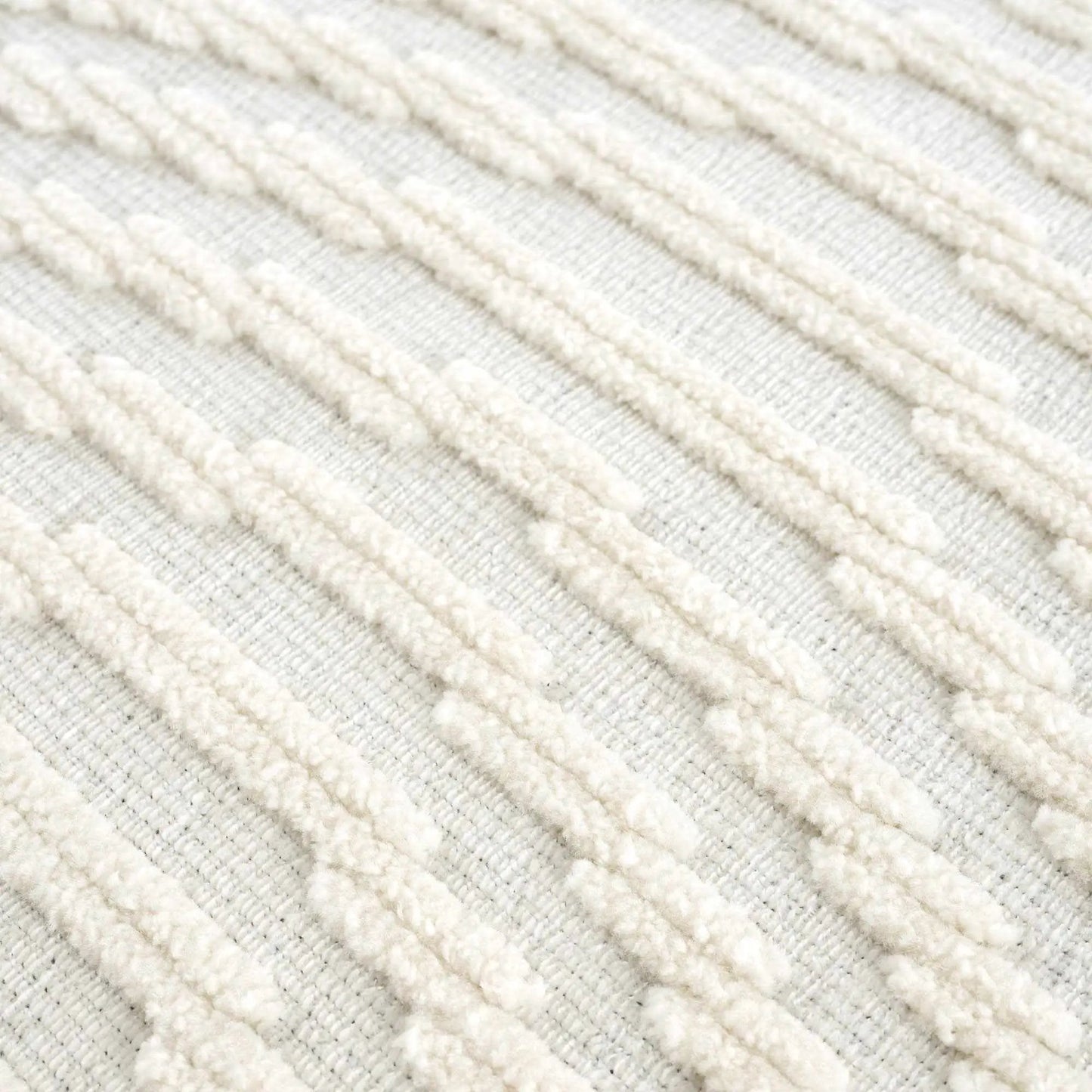 Deron White Washable 3D Rug close-up showcasing plush ivory yarn braids on Tampa Home & Garden Store