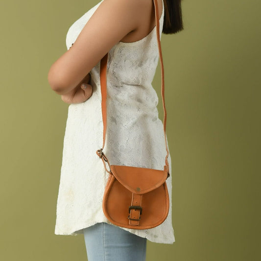 Tan leather crossbody sling bag with adjustable strap for everyday use on Tampa Home & Garden Store