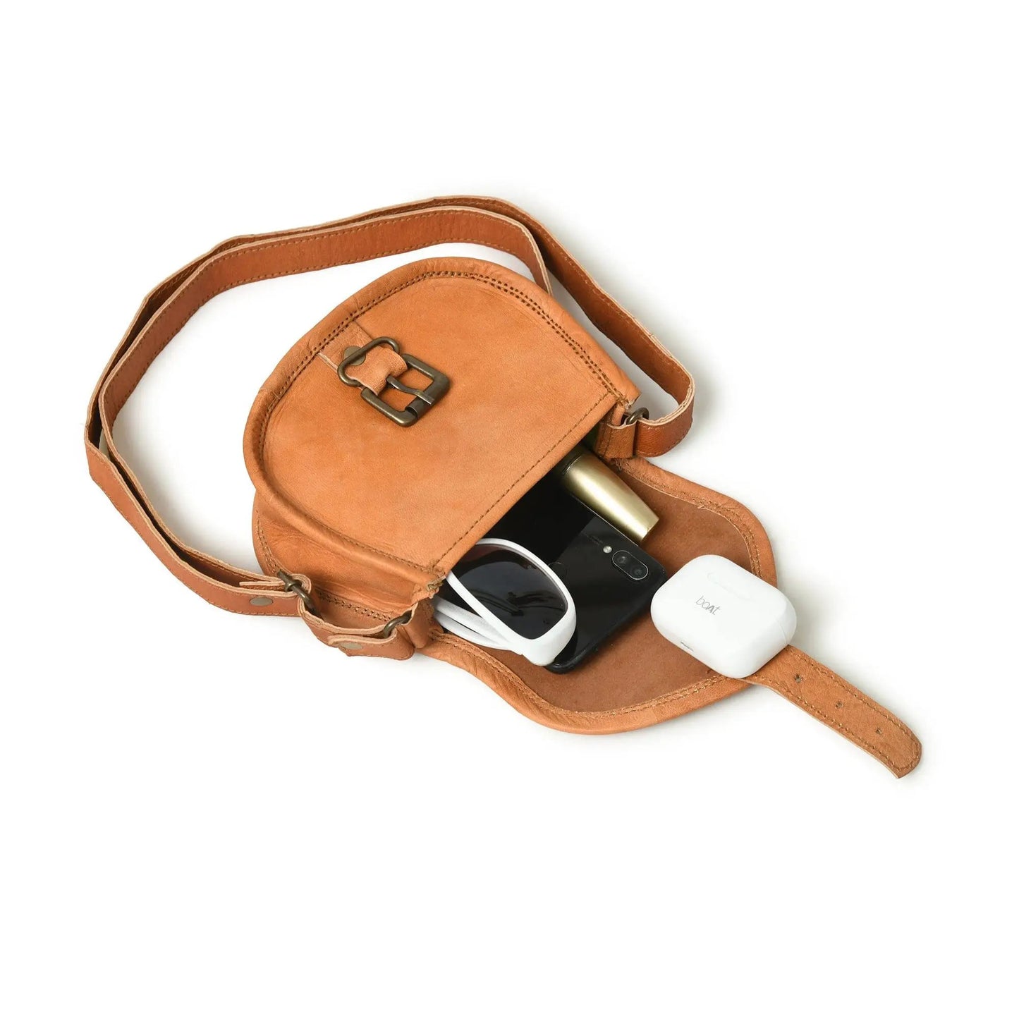 Tan leather crossbody sling bag for everyday use with adjustable strap and brass hardware on Tampa Home & Garden Store