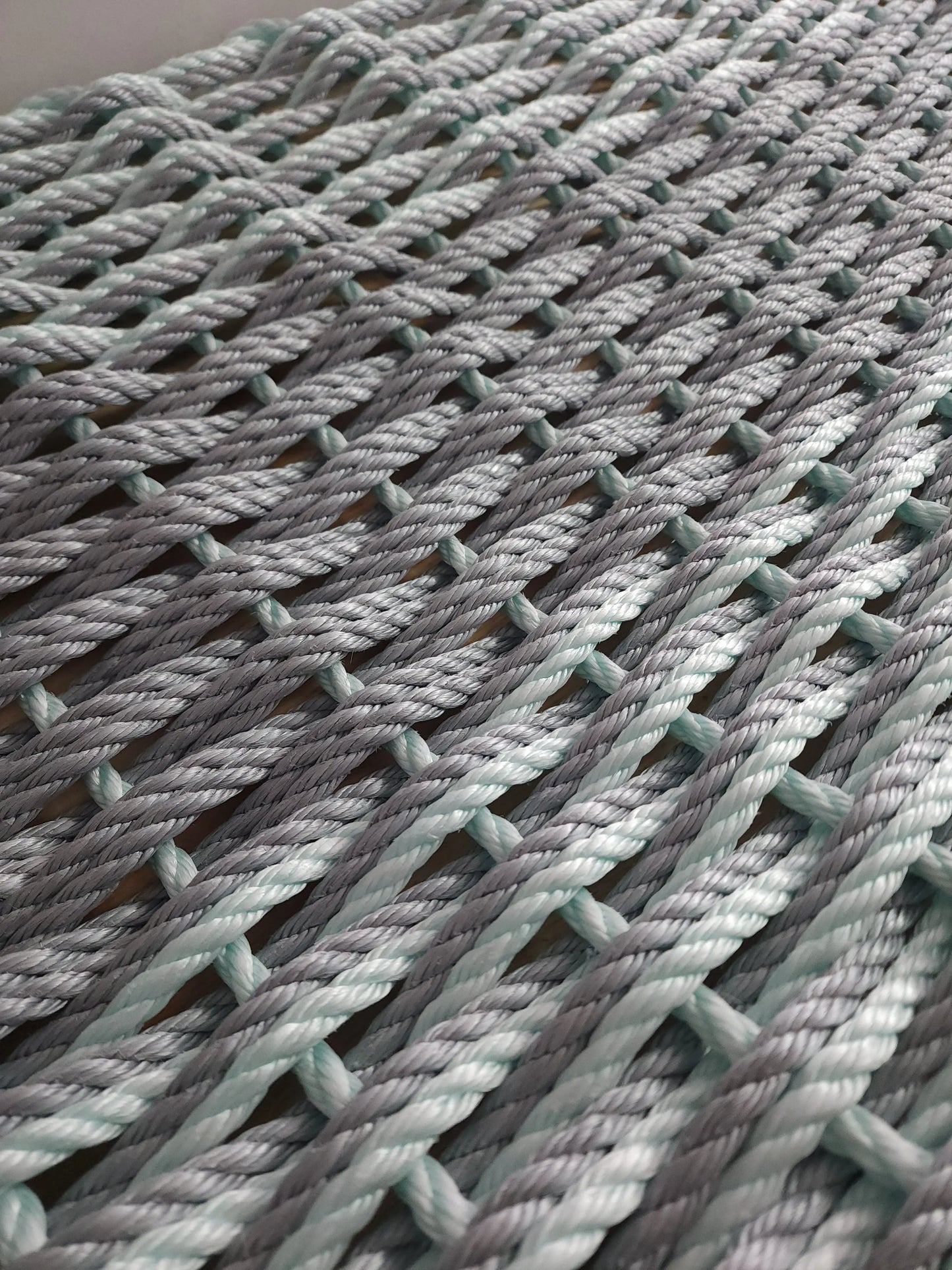 Lobster rope mat in light gray and seafoam, Little Salty Rope rug with woven rope strands on Tampa Home & Garden Store