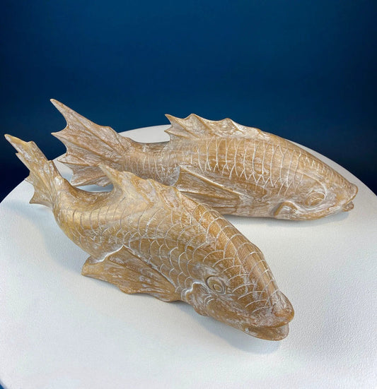 Two large whitewashed wooden koi fish figurines with carved scales on Tampa Home & Garden Store