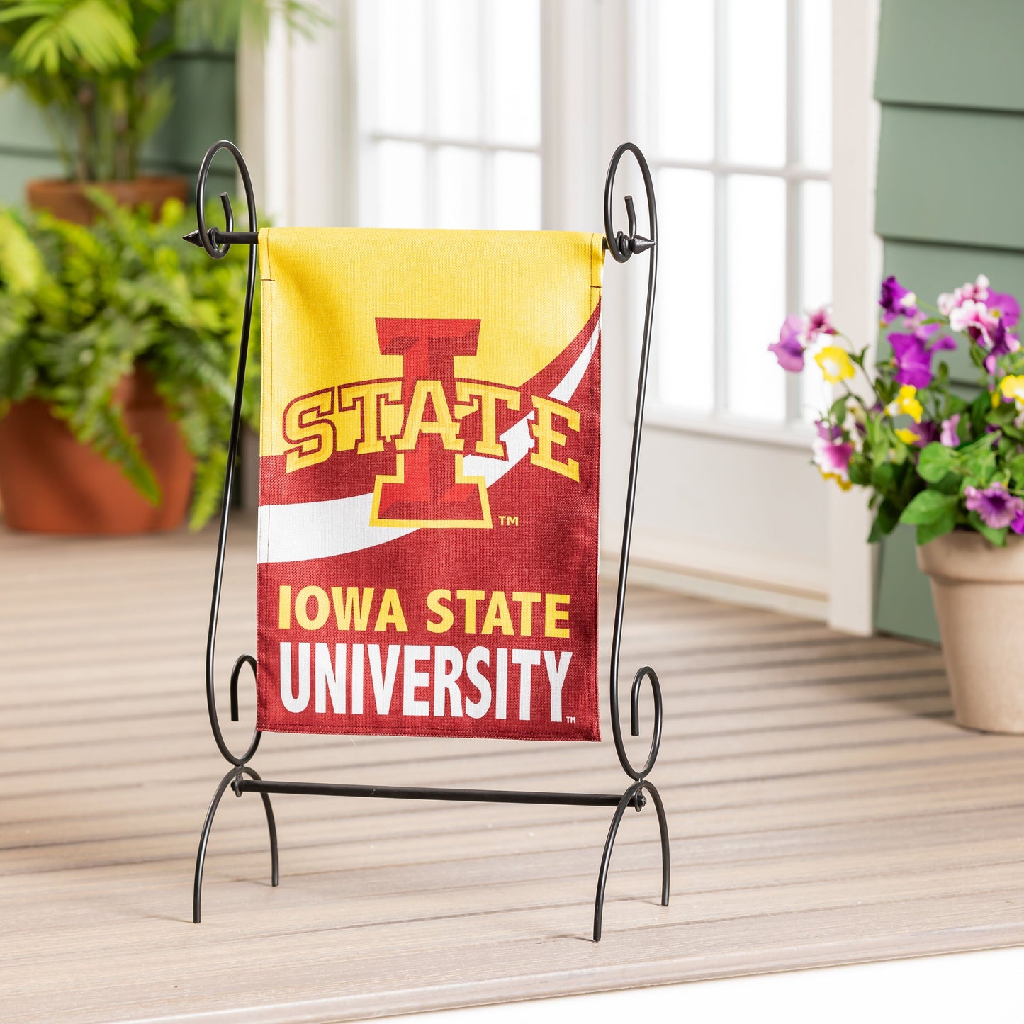 Iowa State University burlap flag on a black metal garden stand with yellow field and red graphic on Tampa Home & Garden Store