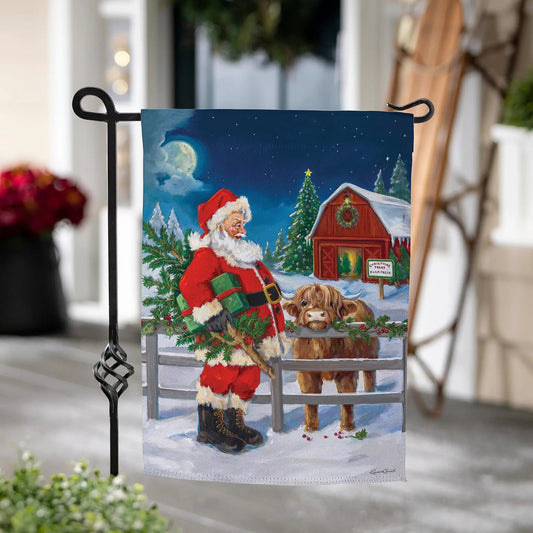 Santa and Highland Cow suede garden flag with gifts beside a barn, starry blue night sky on Tampa Home & Garden Store