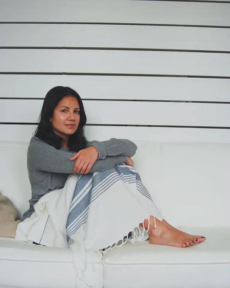 Le Boulou White Turkish Beach Towel white with blue stripes draped on a couch on Tampa Home & Garden Store