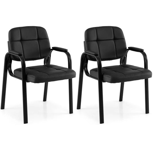 Two black leather office chairs with tufted cushions and curved arms, part of set of four on Tampa Home & Garden Store