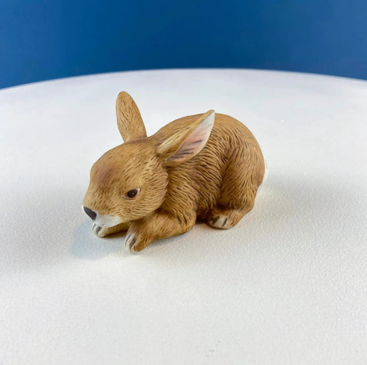 Brown porcelain bunny statuette with carved fur texture on Tampa Home & Garden Store