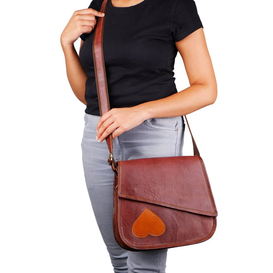 Grimes crossbody bag in brown leather with orange heart patch, adjustable strap on Tampa Home & Garden Store
