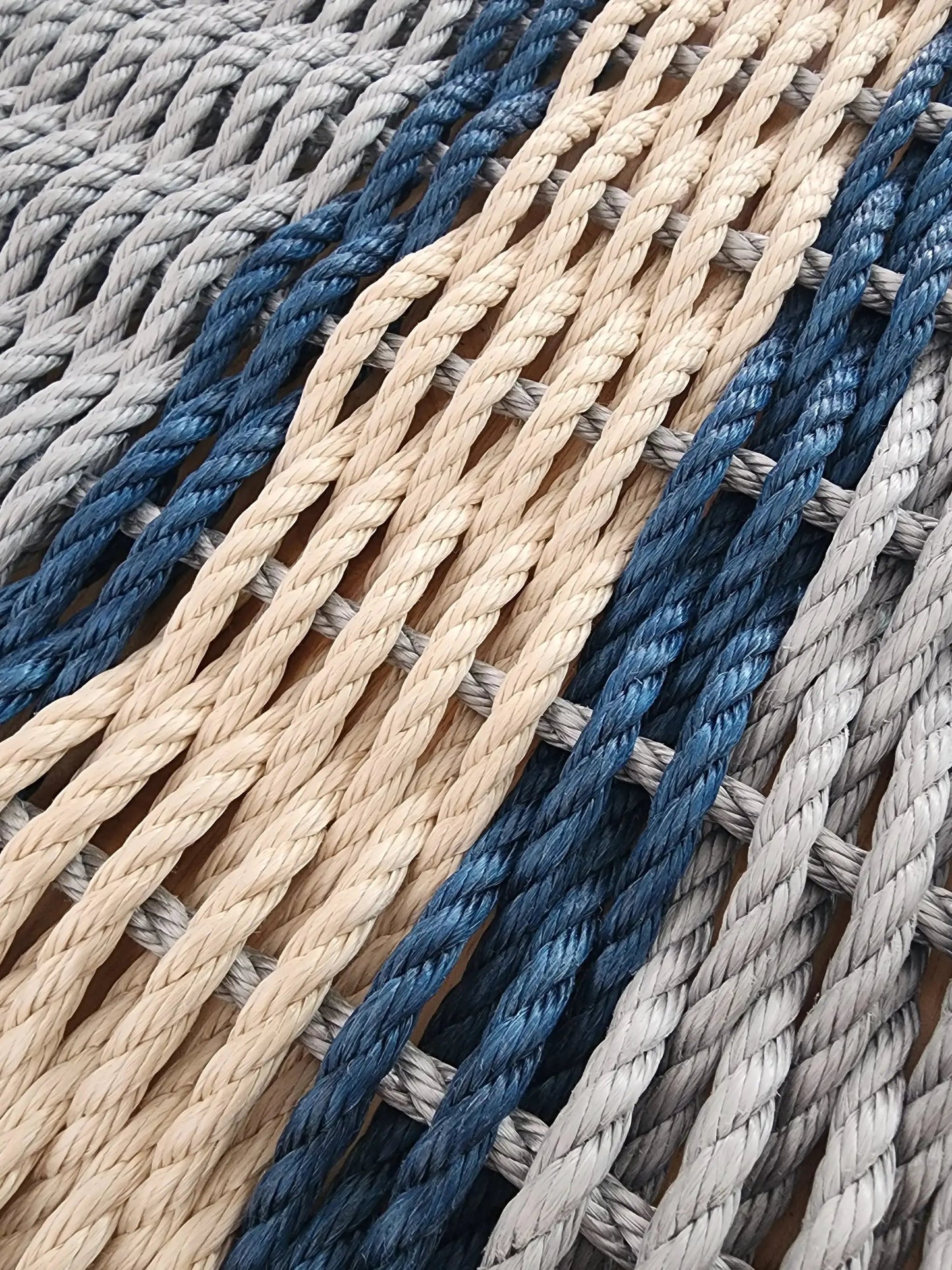 Door mat by Little Salty Rope in light gray and tan with navy blue accents, braided rope weave on Tampa Home & Garden Store