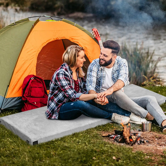 Lightweight memory foam camping mattress with bag beside orange tent and red backpack on Tampa Home & Garden Store