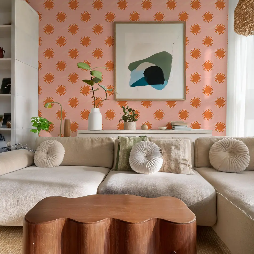 Sol Wallpaper pink and orange sunburst pattern by Samantha Santana Creative in a living room on Tampa Home & Garden Store