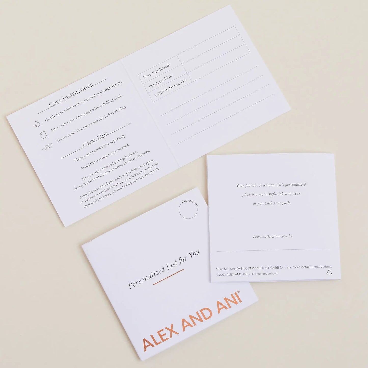 Square Charm Necklace 21'' packaging cards with visible ALEX AND ANI branding on Tampa Home & Garden Store