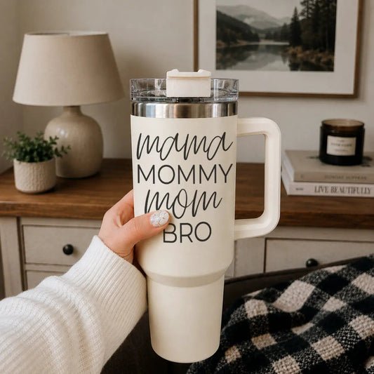 Mama Mommy Bro 40oz insulated travel tumbler with handle, ivory white with bold black script on Tampa Home & Garden Store