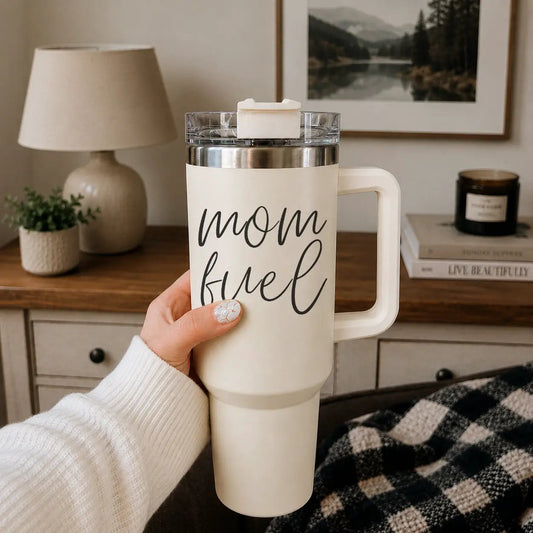 Mom Fuel 40oz tumbler in cream with white handle and clear lid, showing the mom fuel script on Tampa Home & Garden Store