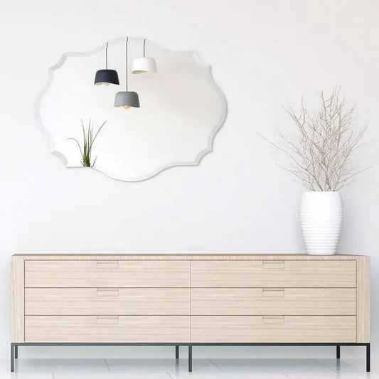 Frameless scalloped beveled accent bathroom mirror, 32 x 24 in, mounted above a wood dresser on Tampa Home & Garden Store