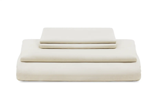 Bed sheets set in cream sateen by Organic Cotton Mart, folded with flat and fitted sheets on Tampa Home & Garden Store