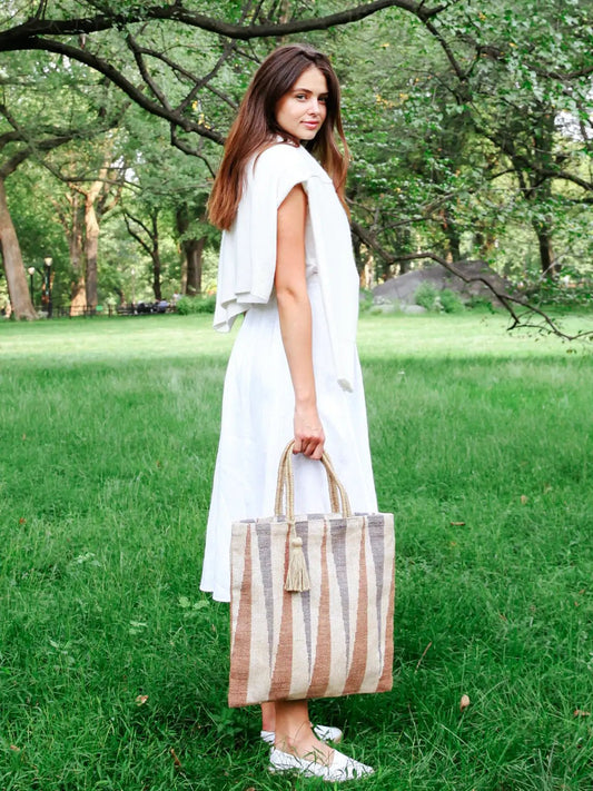 Maja Jute Tote Bag by Korissa, striped beige-brown jute with rope handles and tassels on Tampa Home & Garden Store