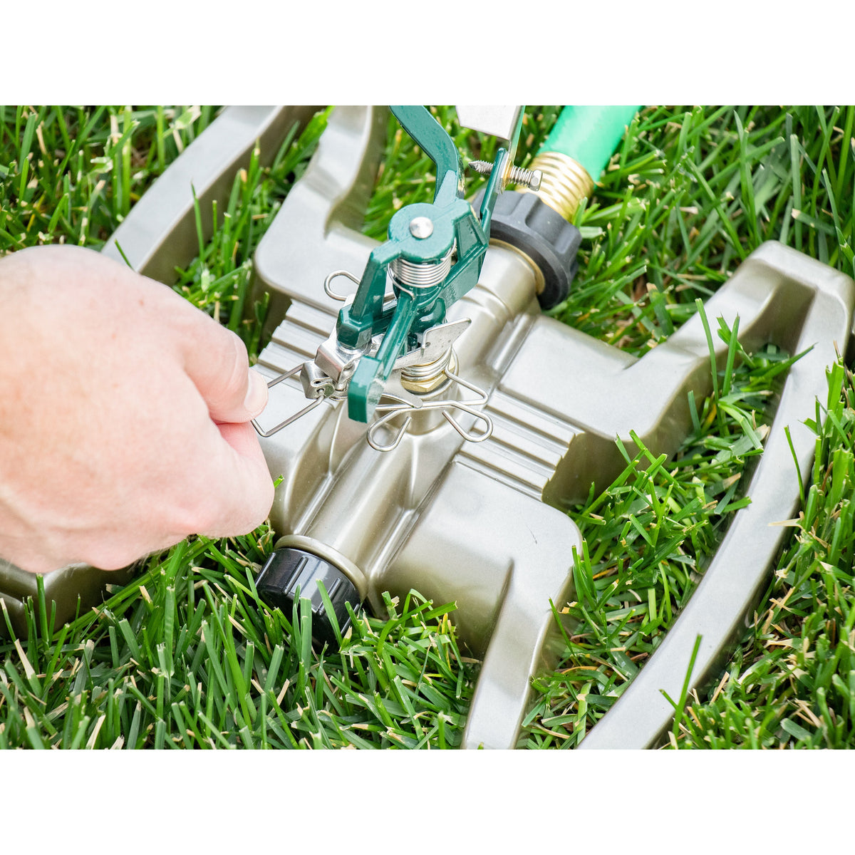 Pro Series Impact Sprinkler with metal sled base, green hose-end sprinkler in grass on Tampa Home & Garden Store