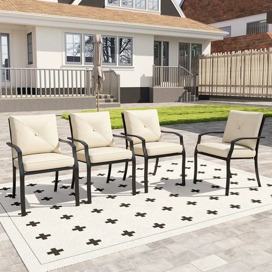 4 beige stackable outdoor dining chairs with metal frames and armrests on a patio on Tampa Home & Garden Store