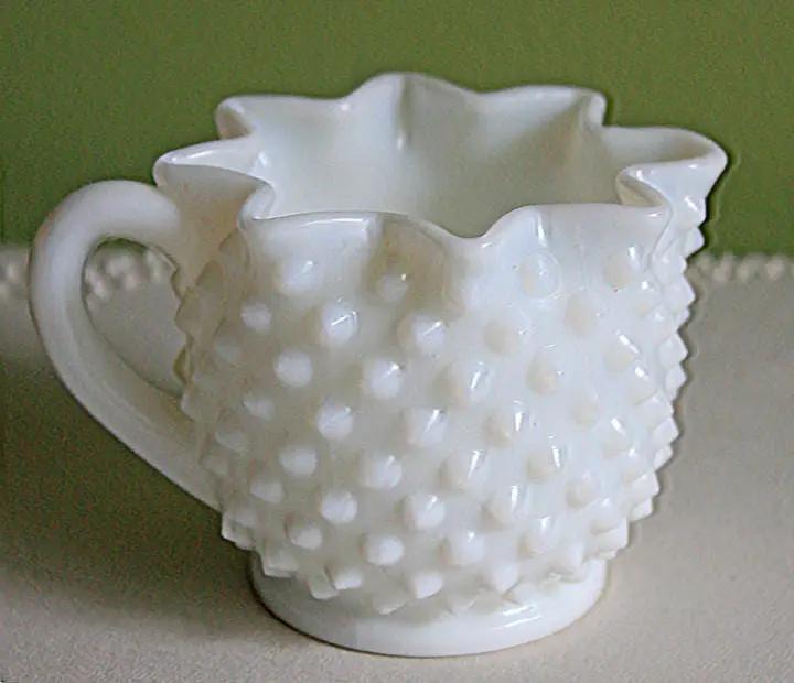Milk glass creamer with leaf motif, hobnail texture and scalloped rim on Tampa Home & Garden Store