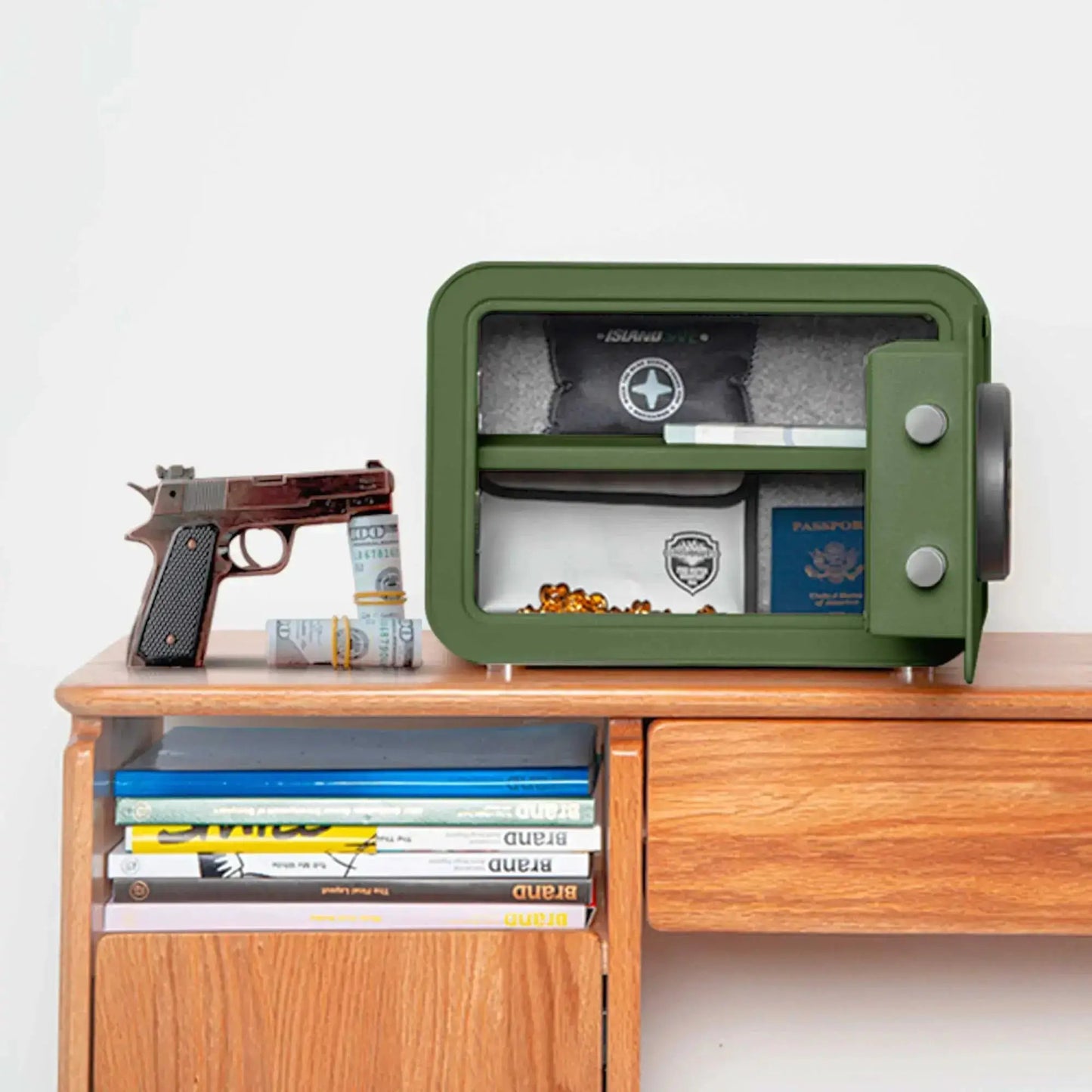 Millitari QT25 compact safe, green ISLANDSAFE, open with cash and valuables on a wooden table on Tampa Home & Garden Store