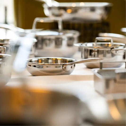 Mini stainless steel saucepan set by Cristel USA on display on Tampa Home & Garden Store