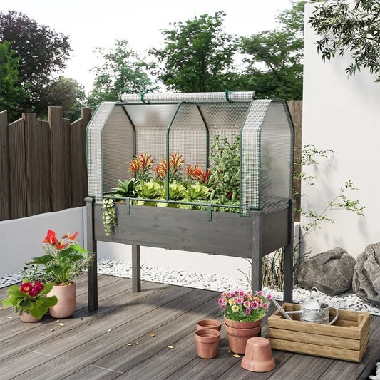 Mini Greenhouse with Roll Up Zipper Door, green frame and white mesh panels on raised bed on Tampa Home & Garden Store
