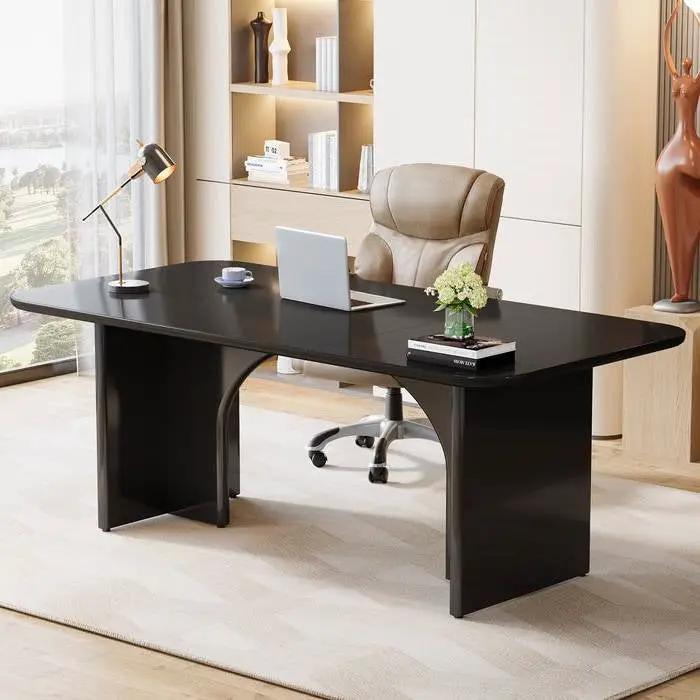 Modern extra-large executive black desk in a home office with laptop and lamp on Tampa Home & Garden Store