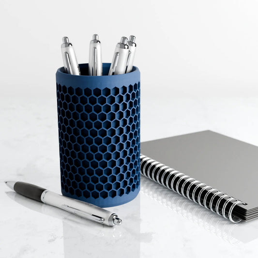 Honeycomb hexagon pencil holder in blue metal with chrome pens on Tampa Home & Garden Store