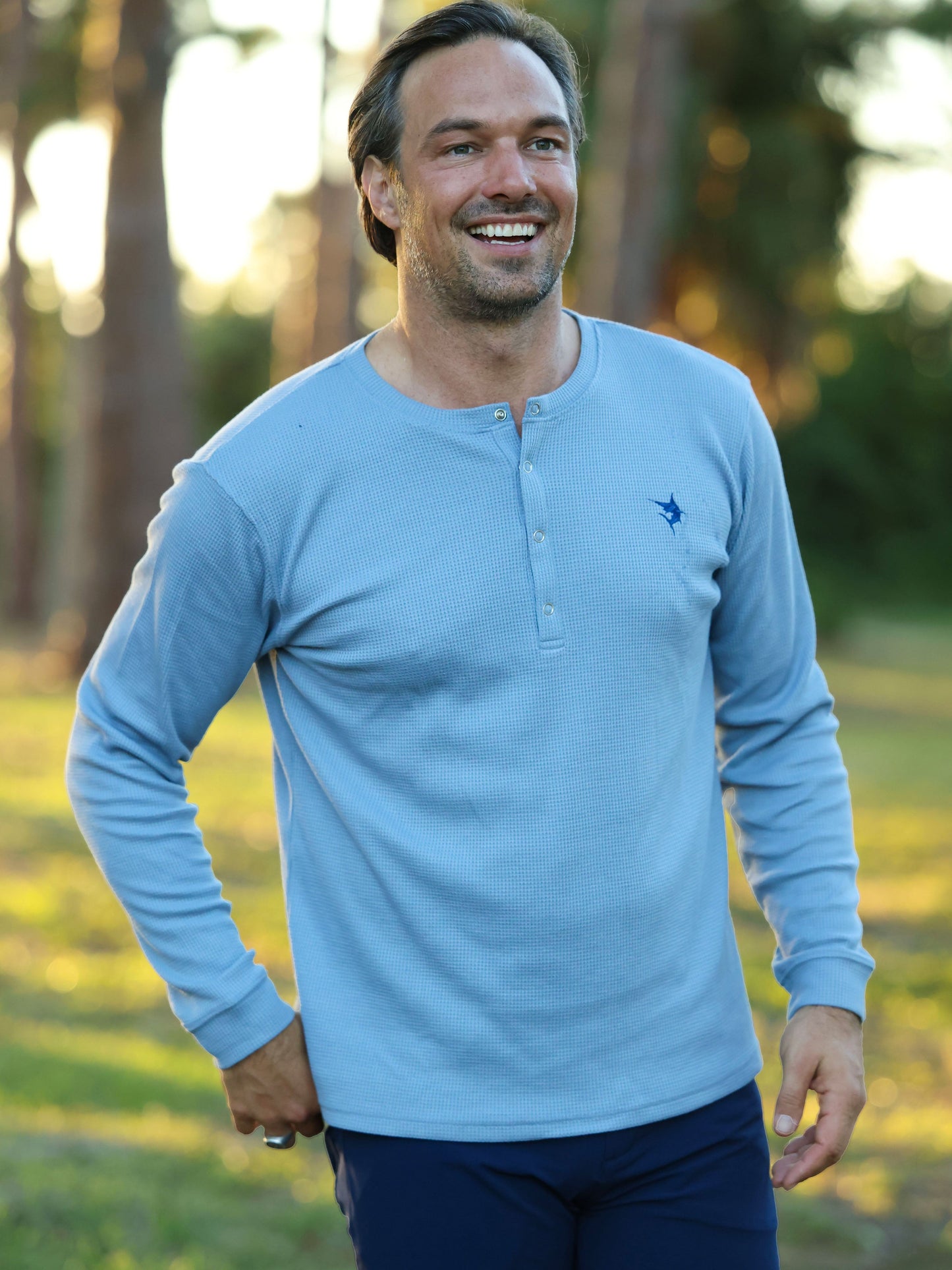 Mystic Henley long sleeve shirt in light blue by White Water Life with chest logo on Tampa Home & Garden Store