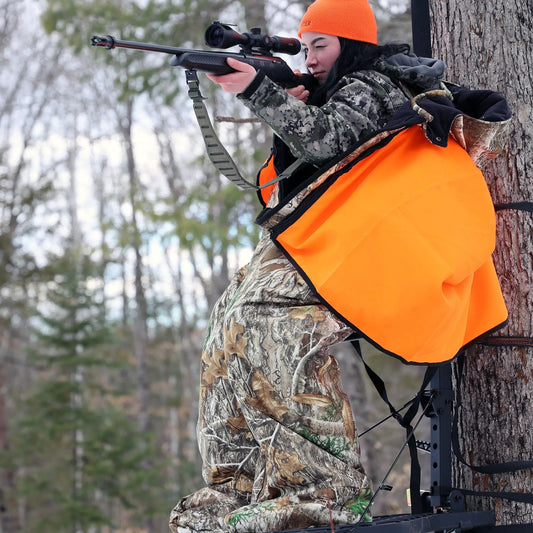 Heater Body Suit Xtreme Overlay outer layer worn by hunter aiming rifle in camo gear on Tampa Home & Garden Store