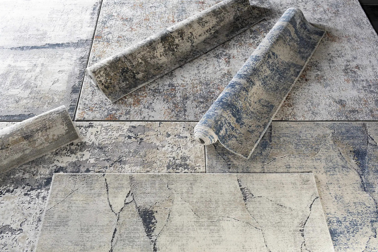 Gasquet Gray Marble Textured Luxe Rug by Boutique Rugs in gray marble pattern, rolled display on Tampa Home & Garden Store