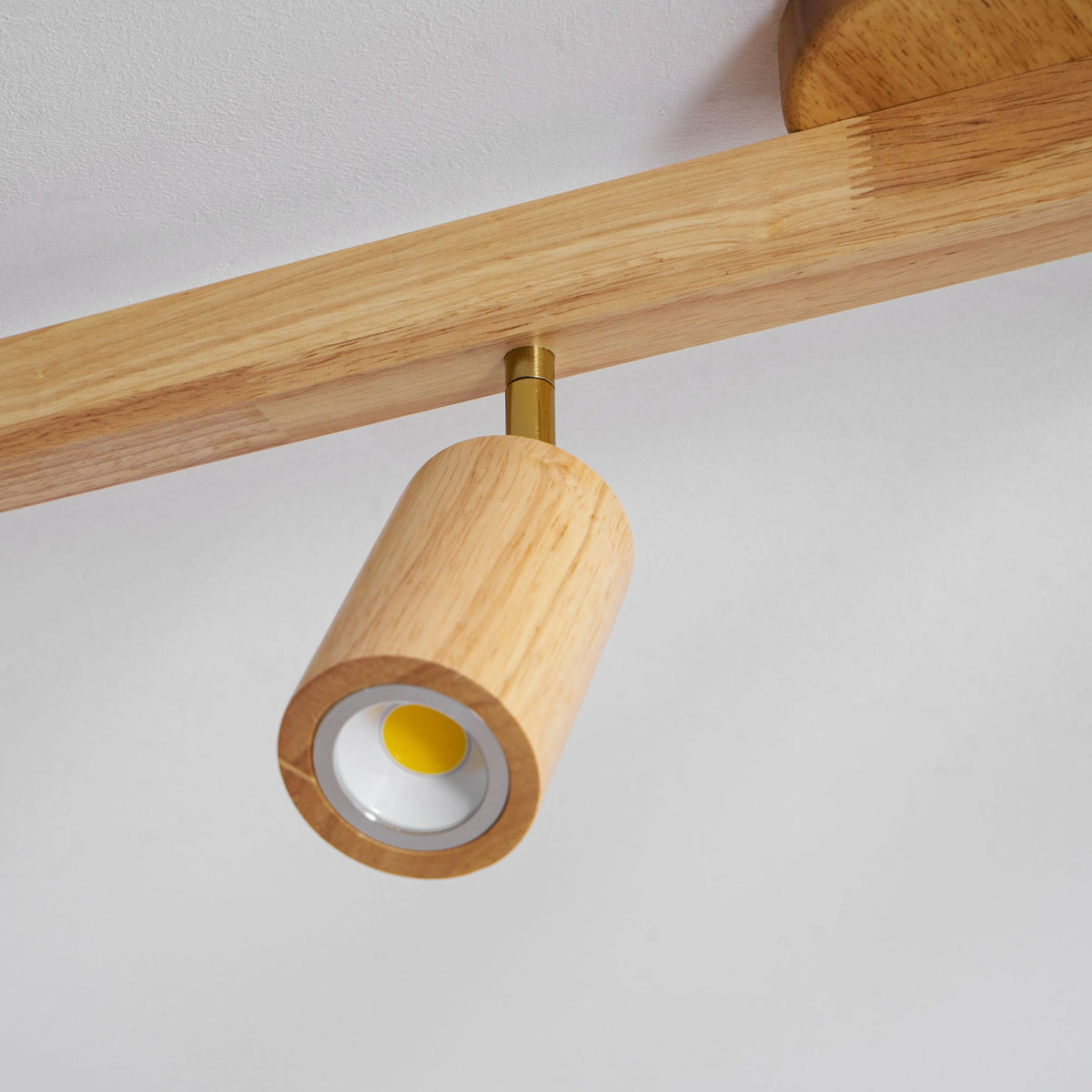 Grain wood shade track spotlight with adjustable heads in natural wood and brass on Tampa Home & Garden Store