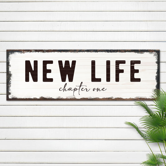 New Life Chapter One Sign canvas by Tailored Canvases, white distressed sign with bold NEW LIFE text and script chapter one on Tampa Home & Garden Store