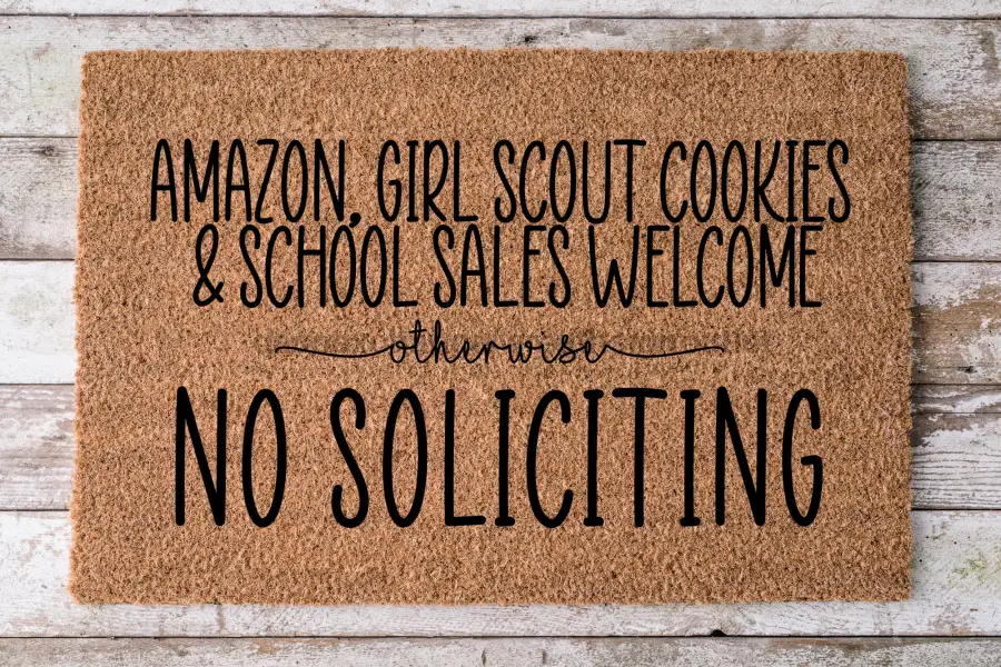DecoExchange No Soliciting coir door mat with bold NO SOLICITING and natural tan color on Tampa Home & Garden Store